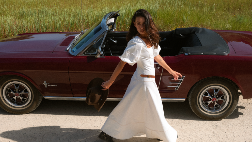 White denim maxi dress with leather belt detail and square neckline