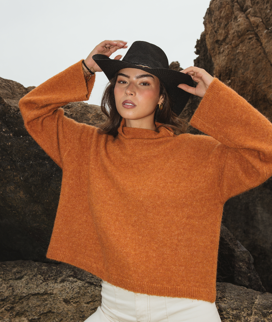 Cropped boxy knitted jumper in saffron made from bouclé wool and alpaca blend