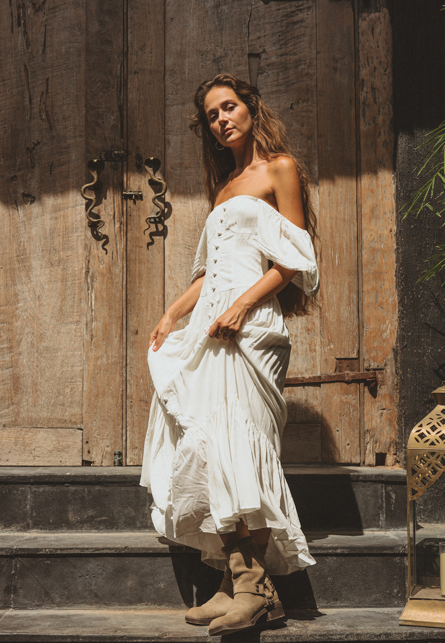 Vintage white organic cotton maxi dress styled outdoors, soft flowing silhouette in natural light