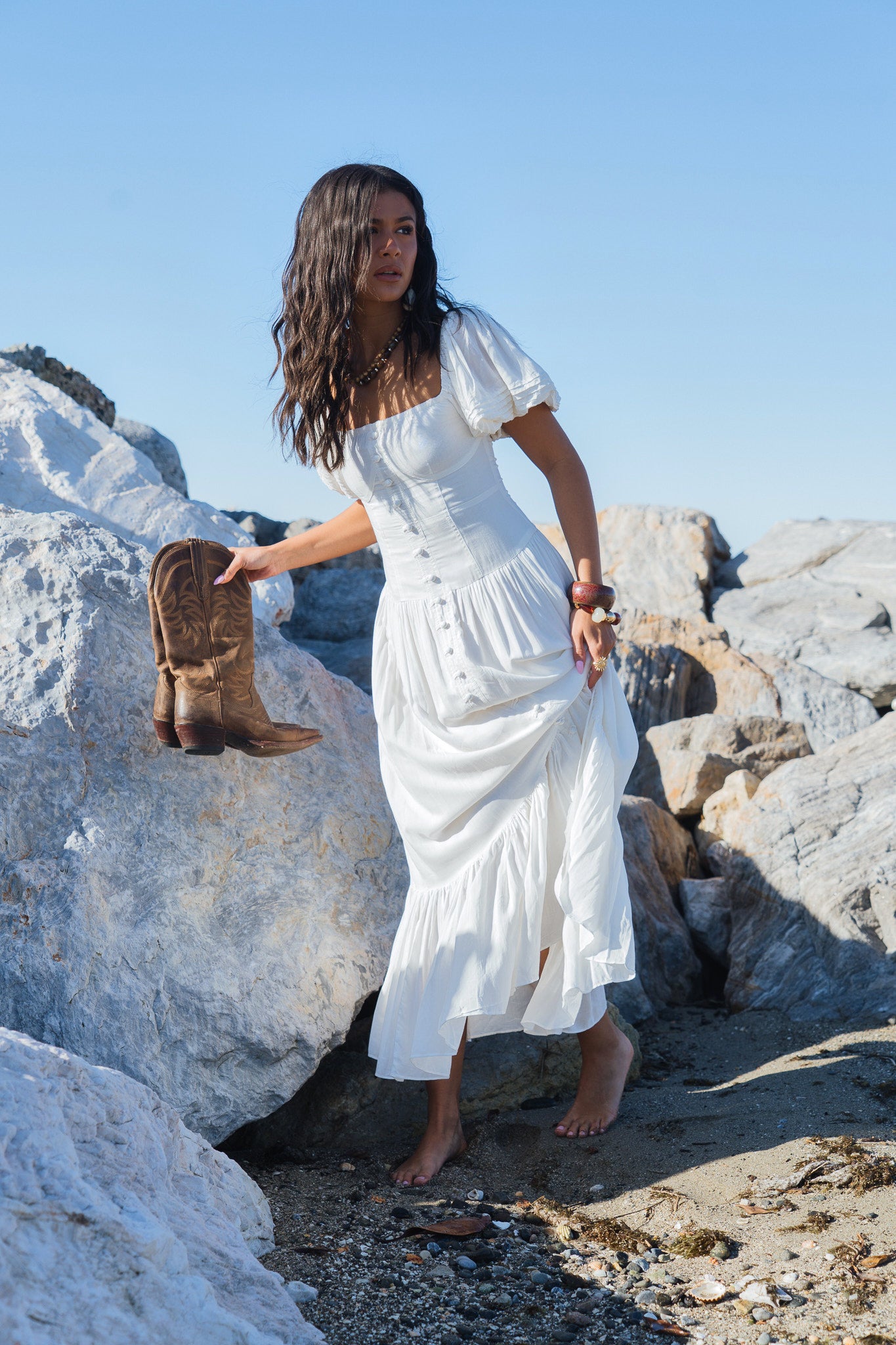 Vintage white organic cotton off-shoulder maxi dress with puff sleeves and flowing silhouette