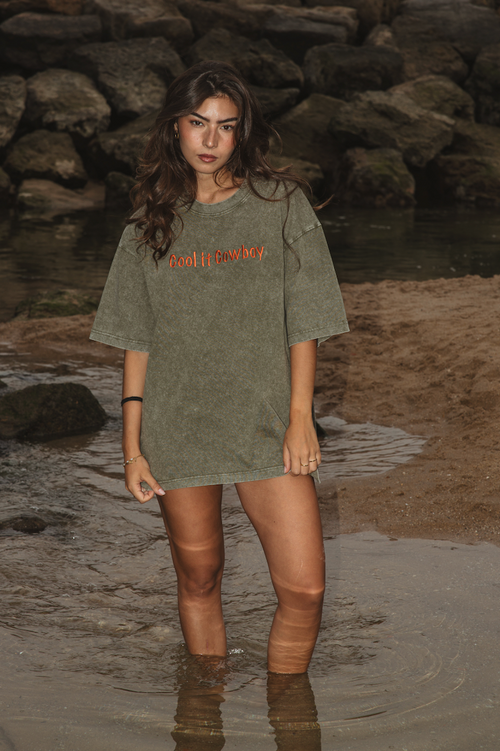 Cool It Cowboy T-shirt in sage green organic cotton with terracotta embroidered slogan