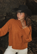 Cropped boxy knitted jumper in saffron made from bouclé wool and alpaca blend