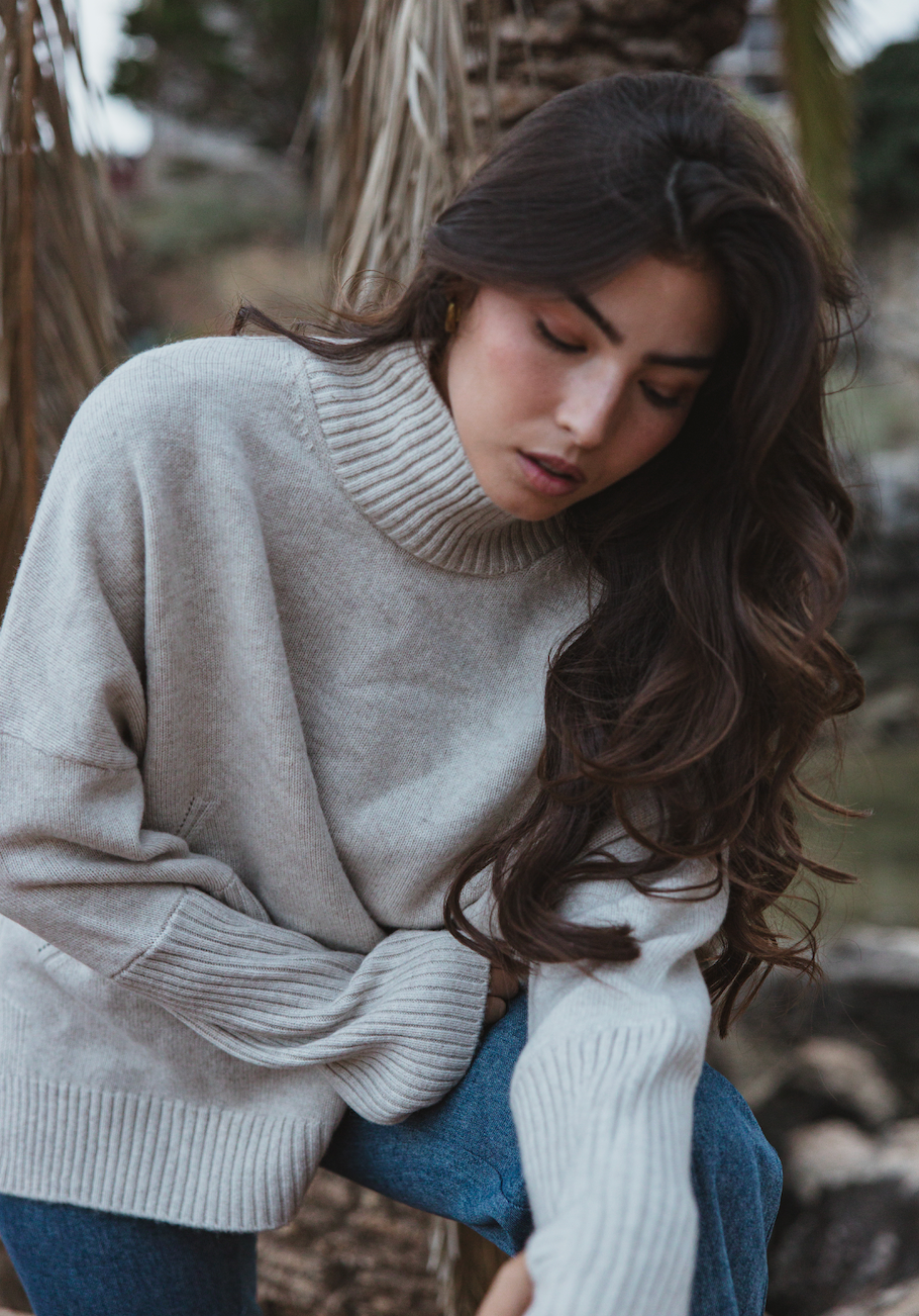 Valentina Jumper in oatmeal, handmade sustainable knit with high neck and thumb holes