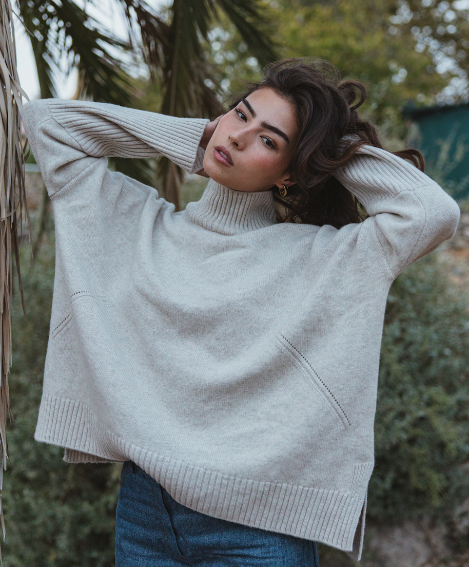 Valentina Jumper in oatmeal, handmade sustainable knit with high neck and thumb holes