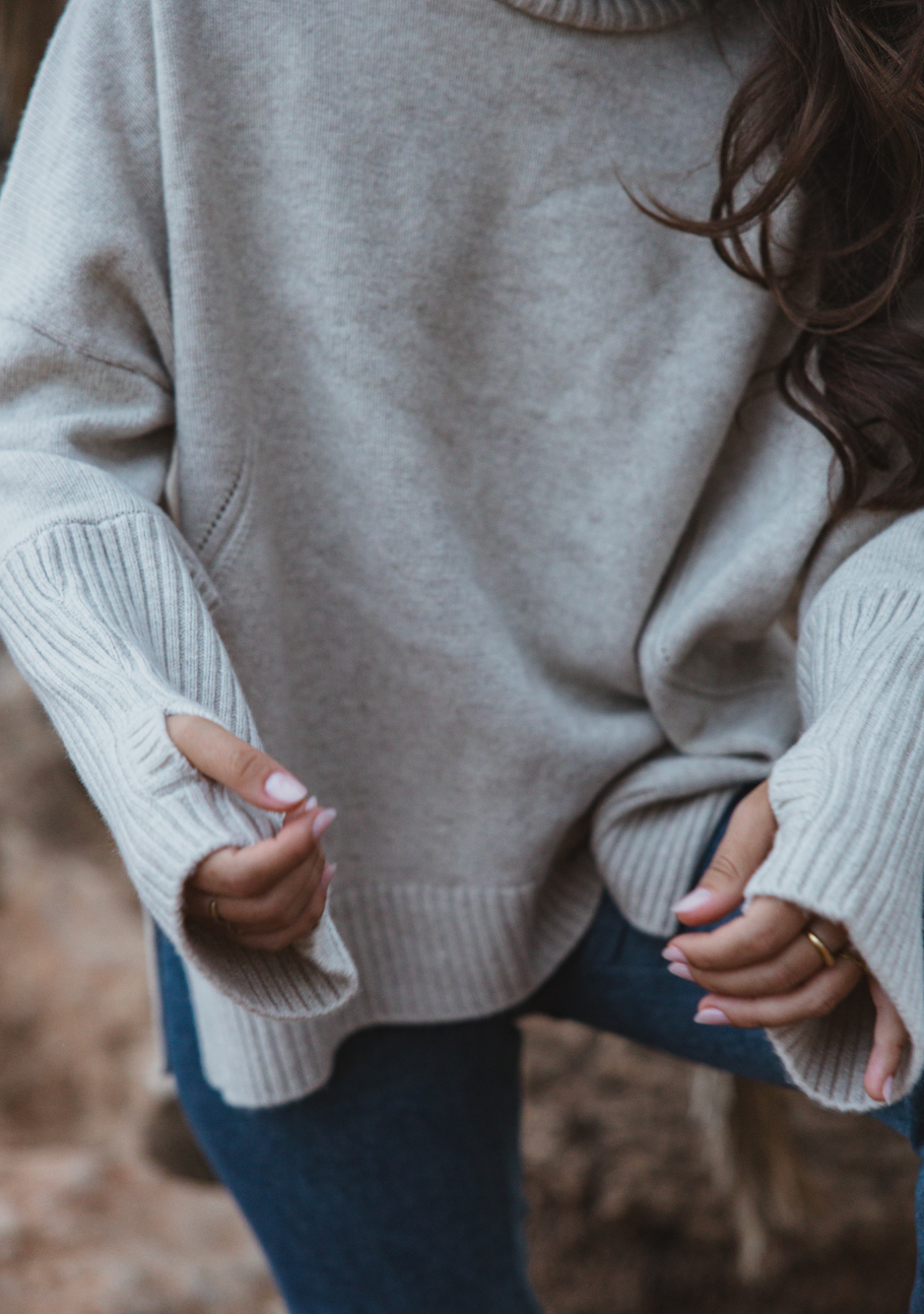 Valentina Jumper in oatmeal, handmade sustainable knit with high neck and thumb holes